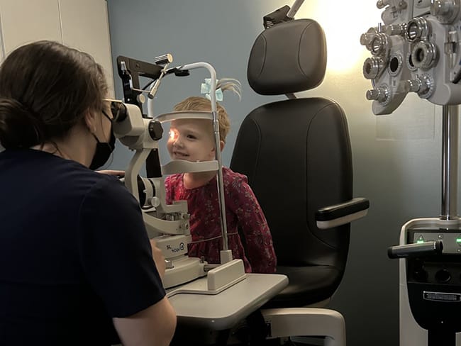 Photo of a child receiving an eye exam.
